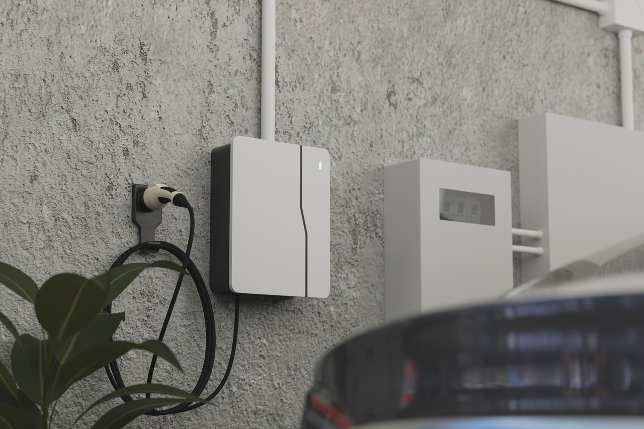 Modern white EV charger mounted on a concrete wall