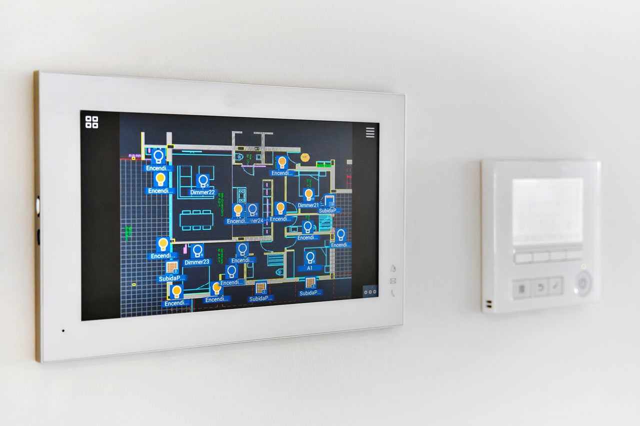 Wall-mounted smart home touchscreen controlling lighting and climate