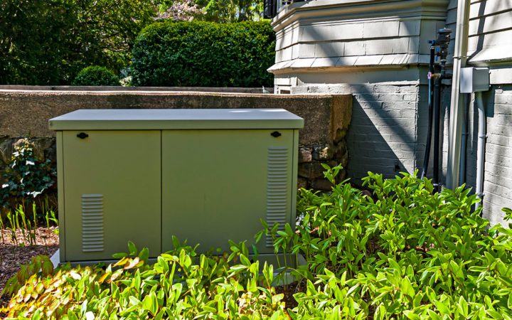 residential standby generator installed on a concrete slab