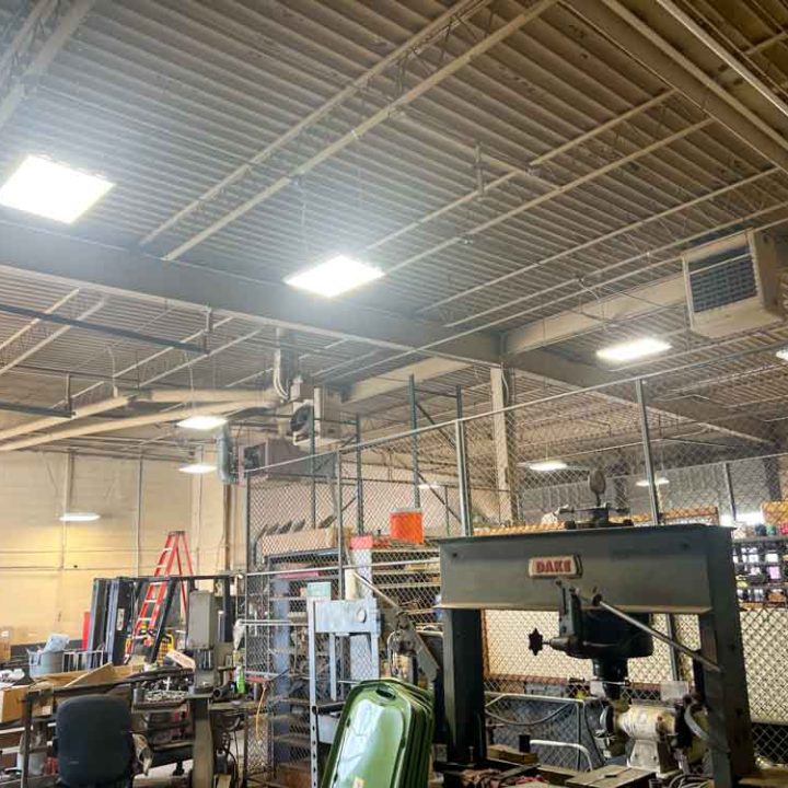 a warehouse with new lighting installation