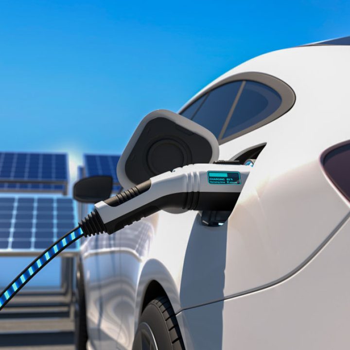 Electric car power charging, solar panel arrays on the background